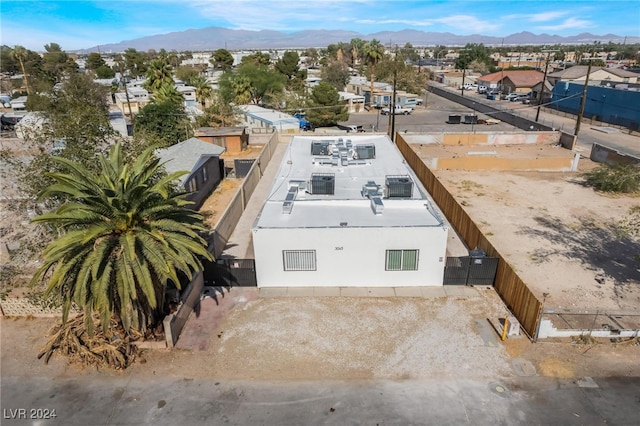 birds eye view of property with a mountain view