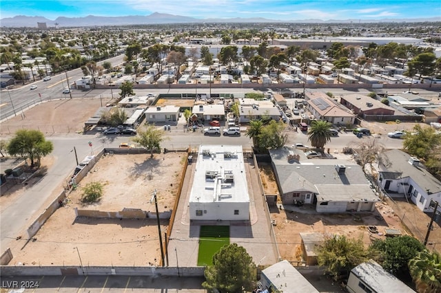 birds eye view of property with a mountain view