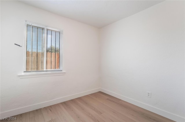 unfurnished room with light hardwood / wood-style flooring