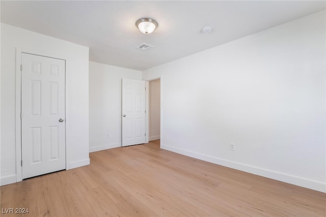 empty room with light wood-type flooring