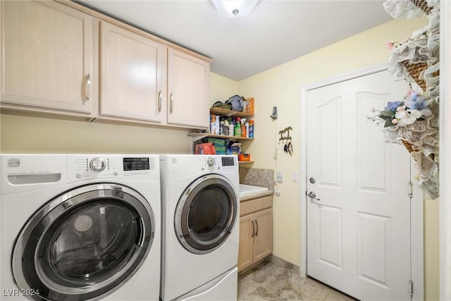 laundry area with cabinets and independent washer and dryer