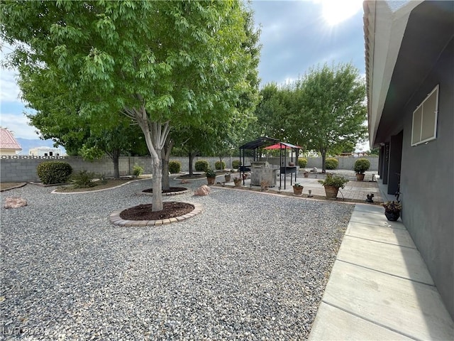 view of yard with a gazebo and a patio