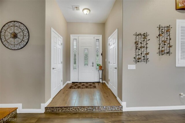 foyer entrance with hardwood / wood-style floors