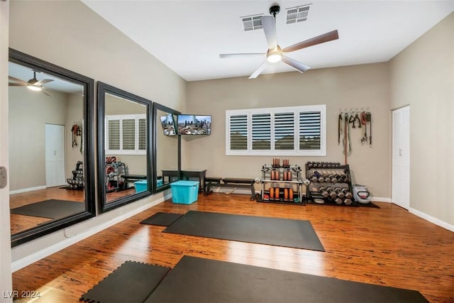 workout area with hardwood / wood-style flooring and ceiling fan