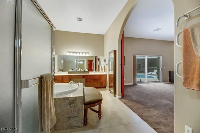 bathroom with tile patterned floors and vanity