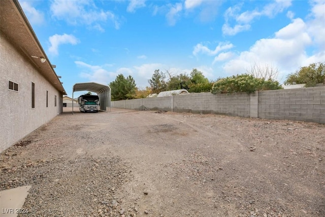 view of yard featuring a carport