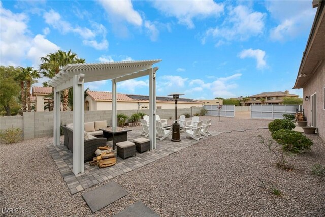 view of patio with an outdoor living space and a pergola