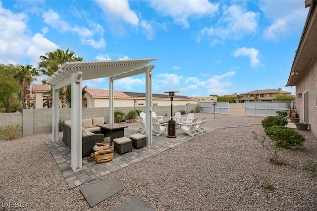 view of patio featuring a fenced backyard, a pergola, and an outdoor hangout area