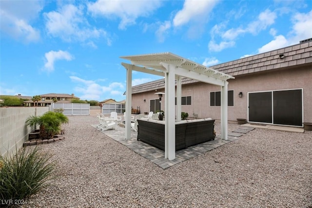 back of house featuring a patio, mansard roof, a pergola, stucco siding, and outdoor lounge area