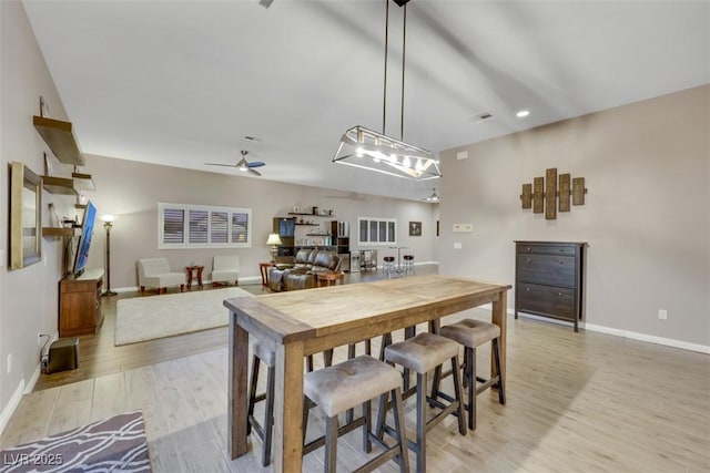 dining room with recessed lighting, baseboards, a ceiling fan, and light wood finished floors