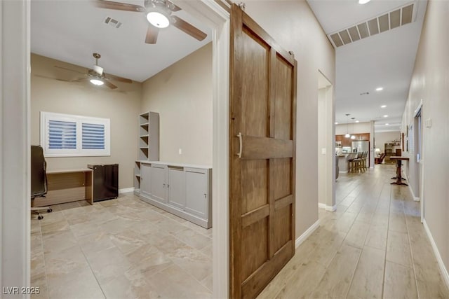 hall featuring visible vents, recessed lighting, light wood-style flooring, and baseboards