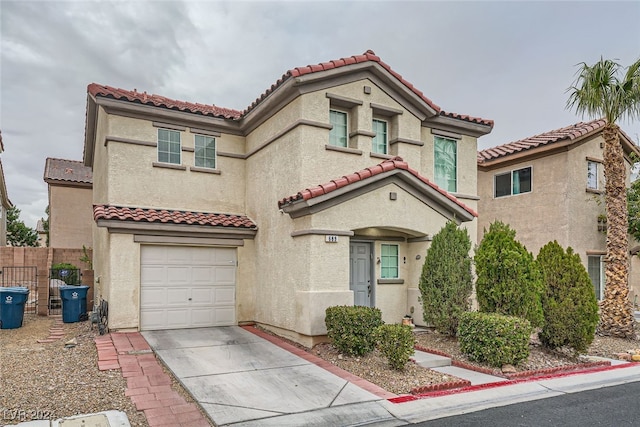 mediterranean / spanish house featuring a garage