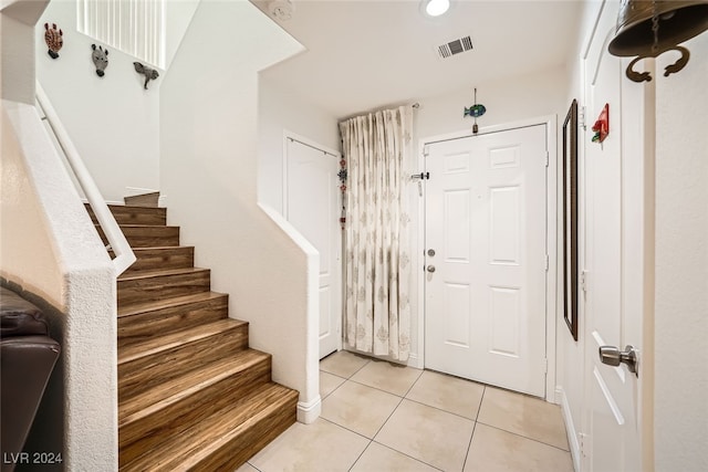 entryway with light tile patterned floors