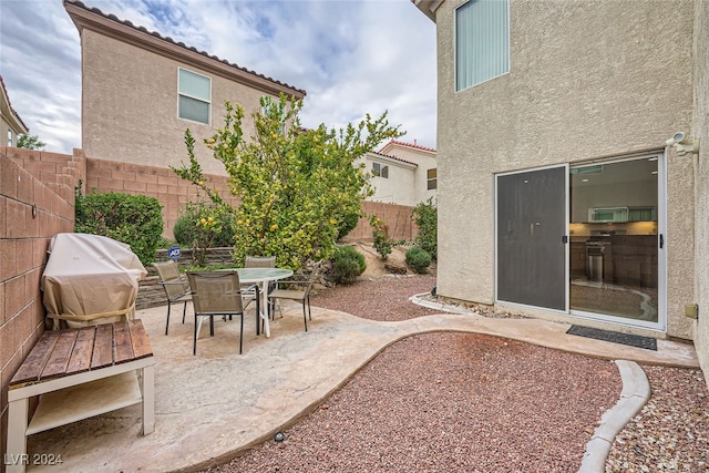 view of patio with a grill