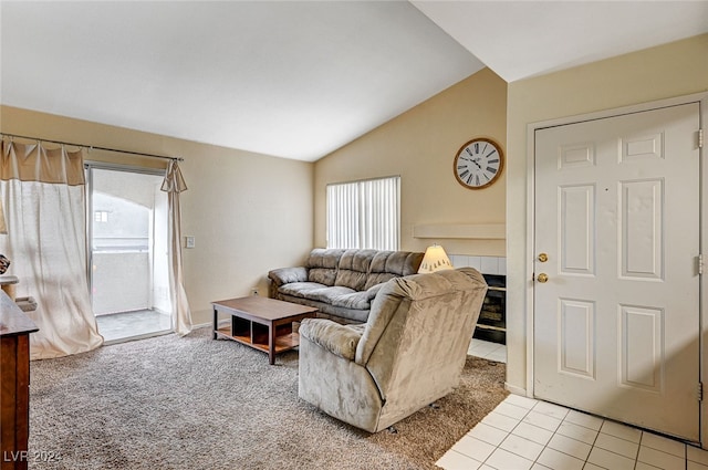 living room featuring light carpet, vaulted ceiling, and a wealth of natural light