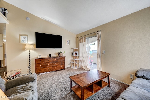 living room with dark colored carpet and lofted ceiling