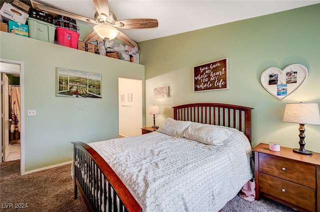 bedroom with ceiling fan and dark colored carpet