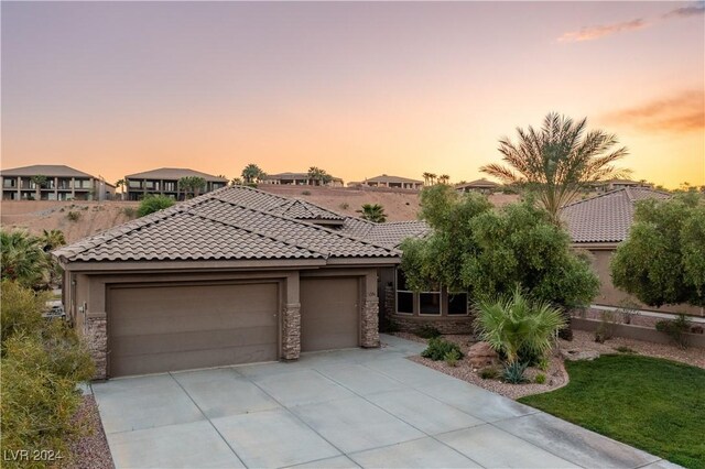 view of front of property with a garage