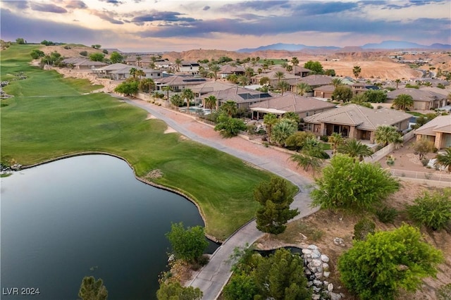 aerial view at dusk with a water view