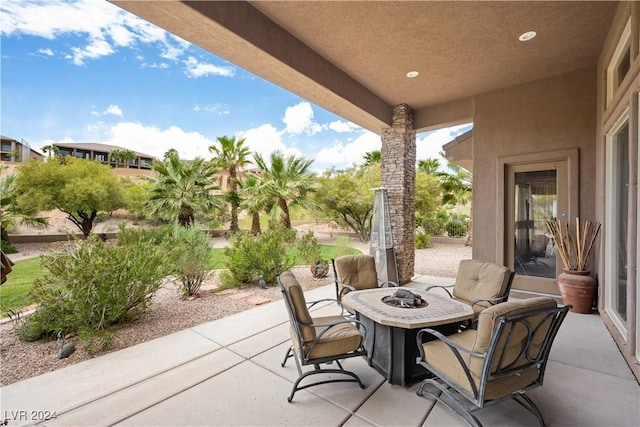 view of patio with an outdoor fire pit