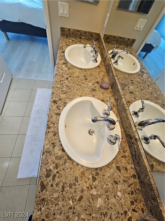 bathroom featuring wood-type flooring and vanity