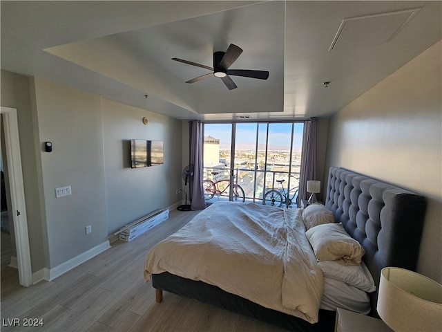 bedroom featuring ceiling fan and light hardwood / wood-style flooring