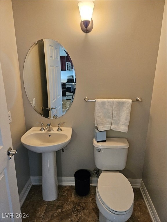 bathroom with toilet and sink