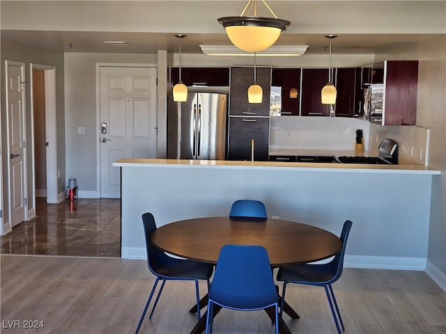 dining room with hardwood / wood-style floors