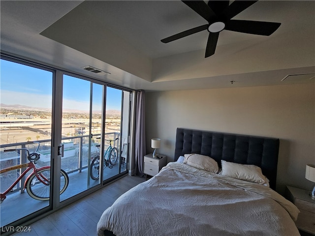 bedroom with access to outside, ceiling fan, and light hardwood / wood-style flooring