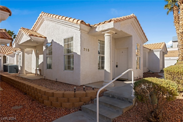 view of front of home featuring central AC unit