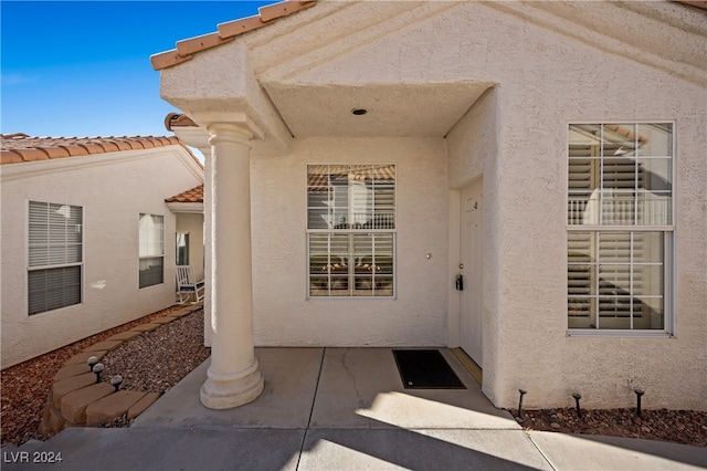 property entrance with a patio area