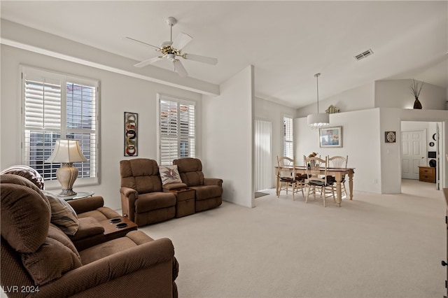 carpeted living room featuring ceiling fan and lofted ceiling