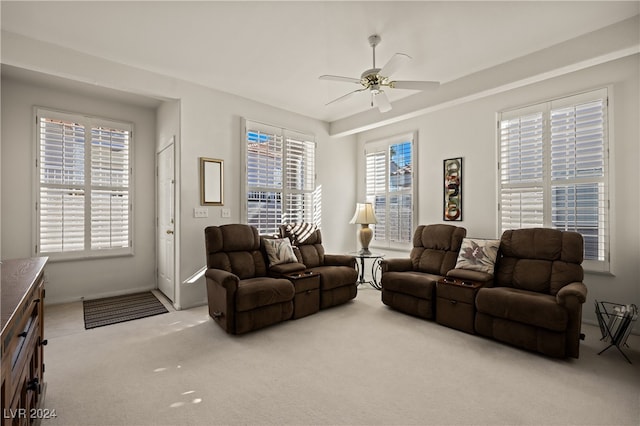 living room featuring a wealth of natural light and light carpet