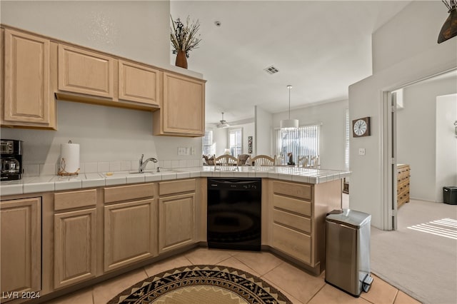 kitchen featuring kitchen peninsula, light carpet, sink, tile countertops, and black dishwasher