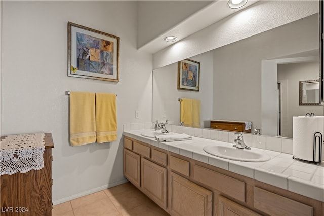 bathroom featuring tile patterned flooring and vanity