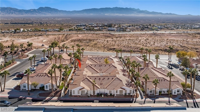 birds eye view of property with a mountain view