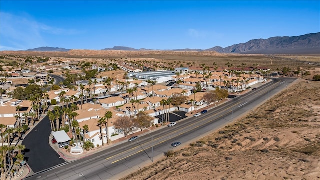 birds eye view of property featuring a mountain view