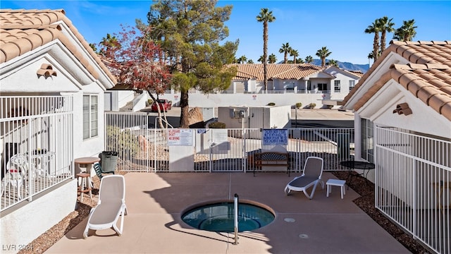 view of patio with a community hot tub