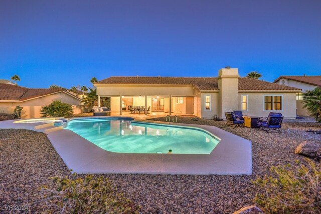 view of pool with a patio area and an in ground hot tub