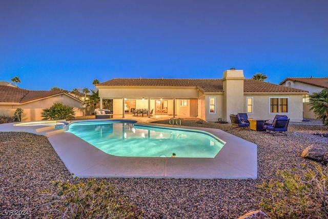 view of pool with a patio area and an in ground hot tub