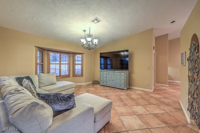 living room with a notable chandelier, vaulted ceiling, a textured ceiling, and light tile patterned floors