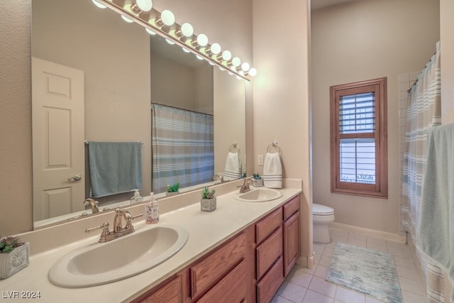 bathroom with tile patterned flooring, vanity, curtained shower, and toilet