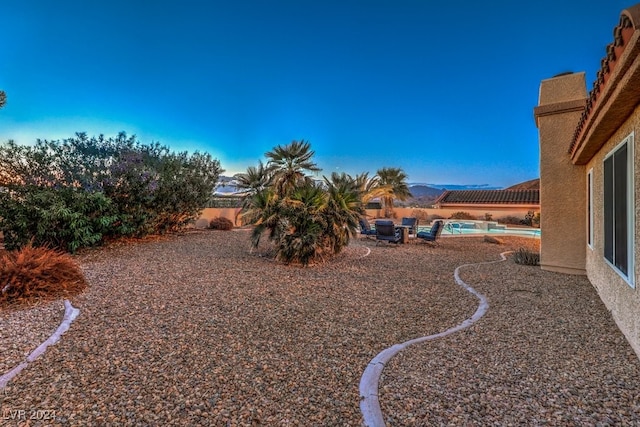 view of yard with a fenced in pool