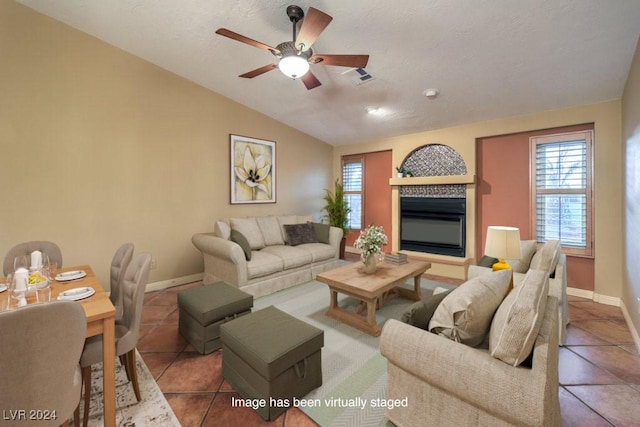 living room with vaulted ceiling, tile patterned floors, and ceiling fan