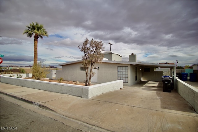 view of front of home with a carport