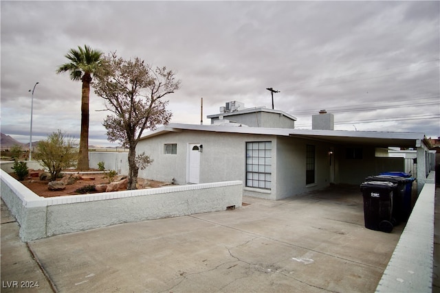 exterior space with a carport