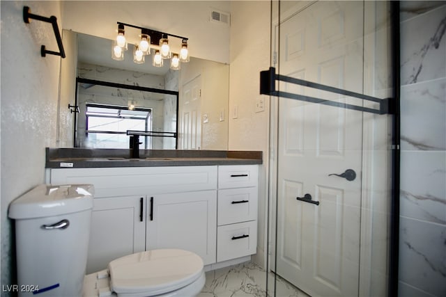 bathroom featuring vanity, toilet, and an enclosed shower