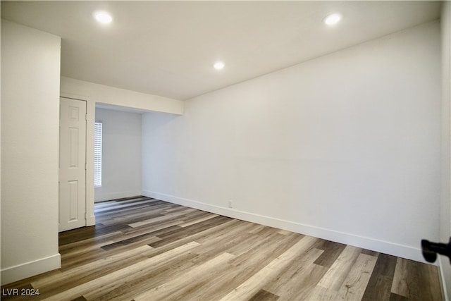 unfurnished room with wood-type flooring