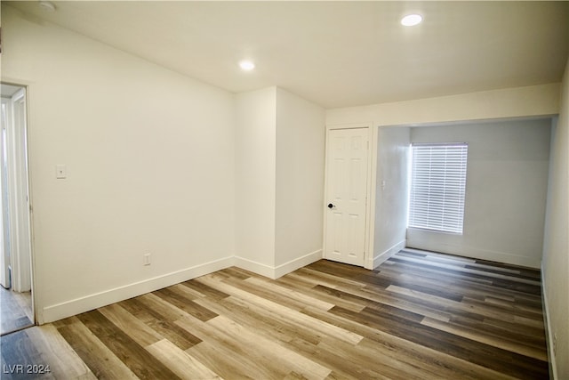 empty room with hardwood / wood-style floors