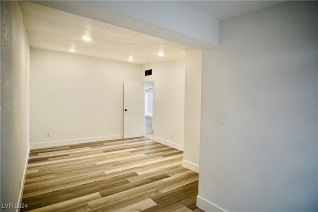 unfurnished room with light hardwood / wood-style floors